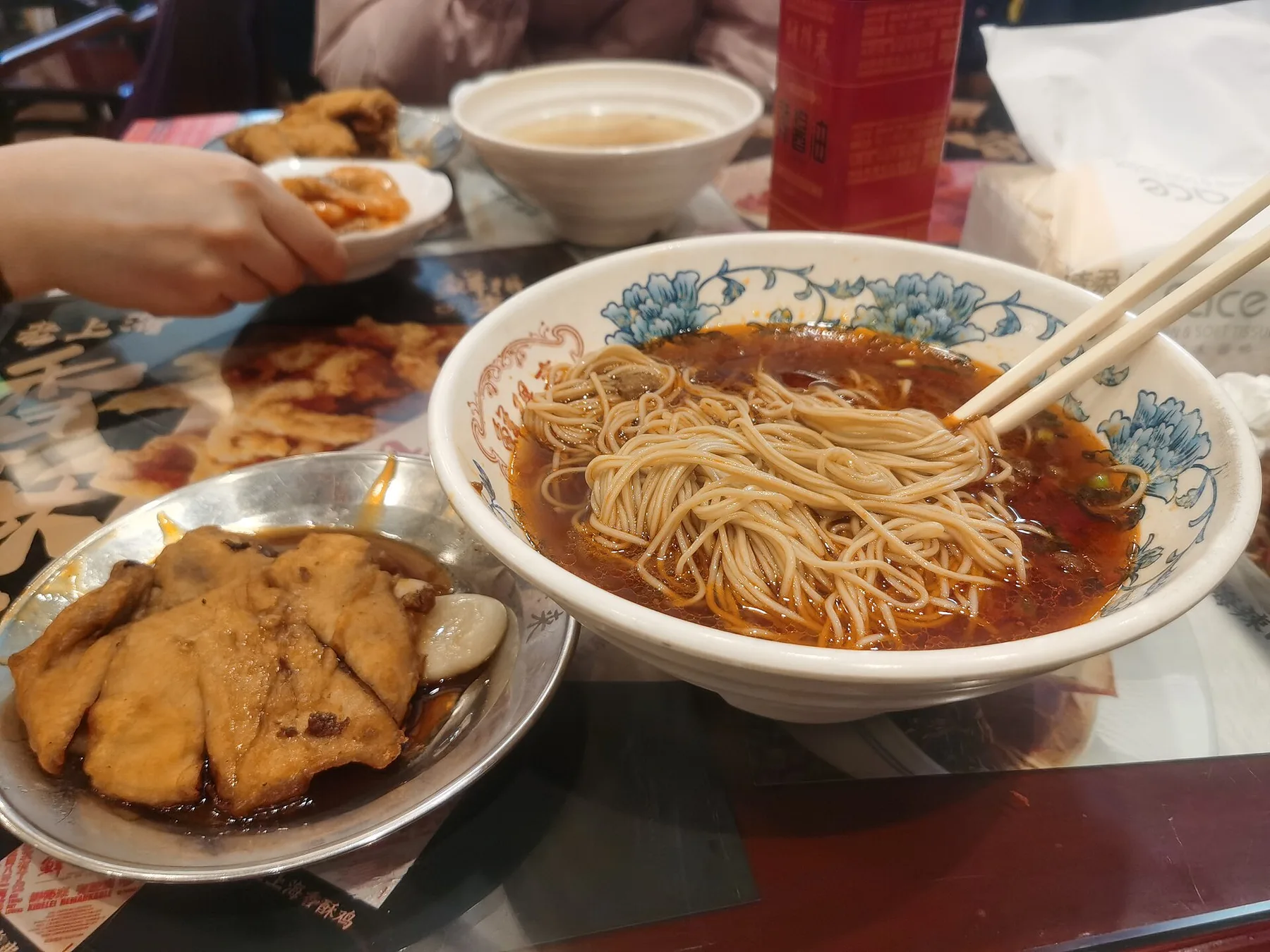 Xiandelai Pork chop with Nian gao and spicy pork noodles